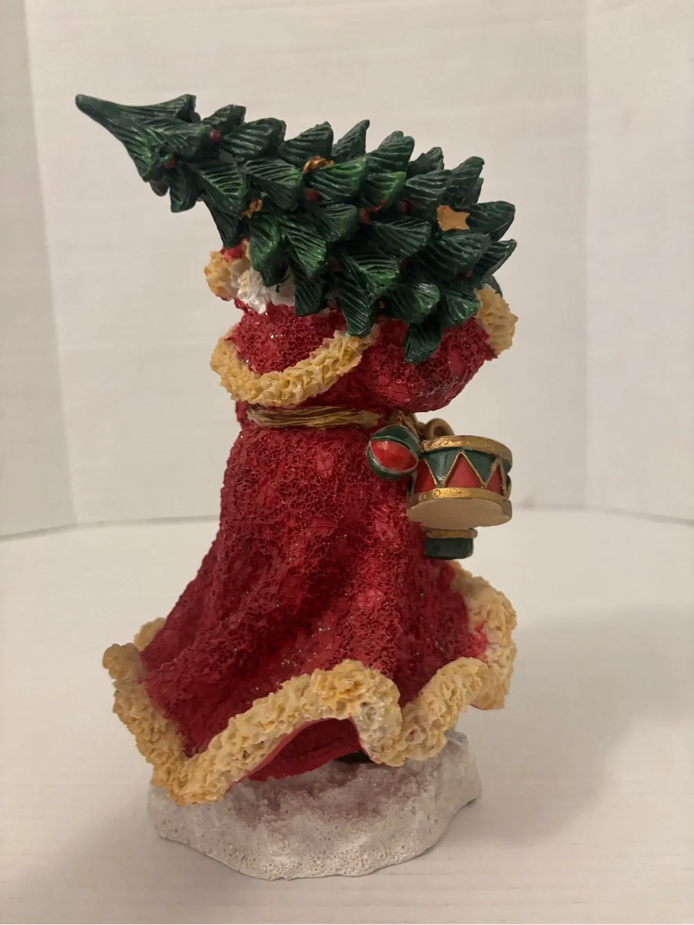 Festive Red Santa Figurine with Green Tree and Brown Toy Sack
